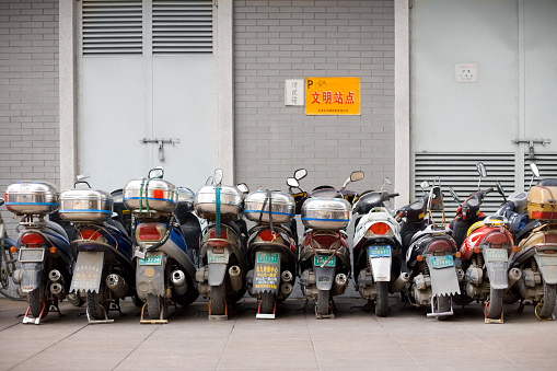 Shanghai, China -  November 11, 2008: Motorcycles at a parking zone in downtown.