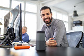 Businessman using digital speaker at office