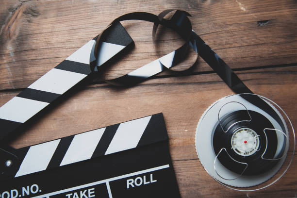 istock Cinema movie clapper board on the desk 1212019452