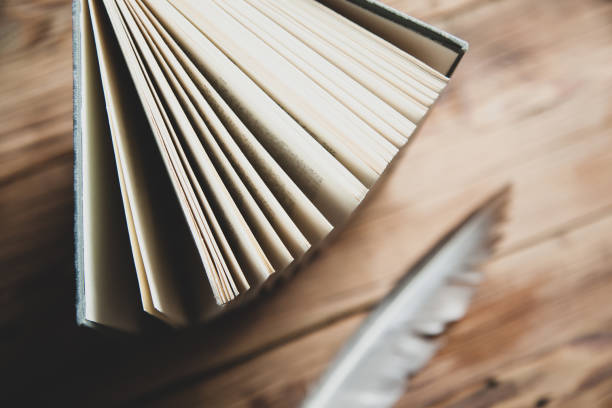 istock books page on the wooden desk background 1212019457