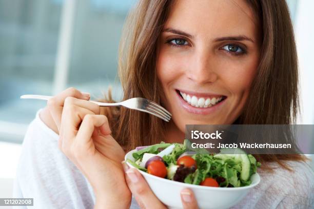 Closeup Of Happy Woman Eating Vegetable Salad Stock Photo - Download Image Now - Women, Eating, Healthy Eating