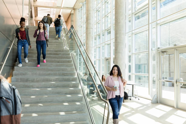 istock Group of college students on their way to class 1212021565