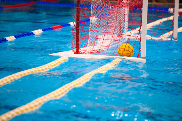 Water polo players Water polo action in a swimming pool water polo stock pictures, royalty-free photos & images