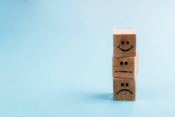 istock Emoticon icons face on Wooden Cube , Costumer service concept 1212022315