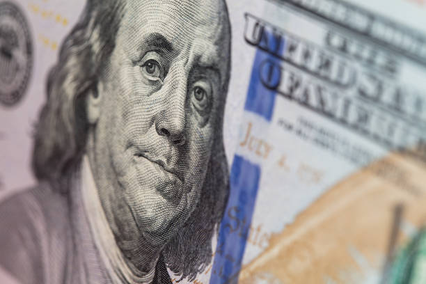 istock fragment of 100 dollar bill 1212022494
