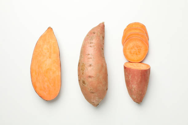 istock Flat lay with sweet potato on white background, top view 1212024053