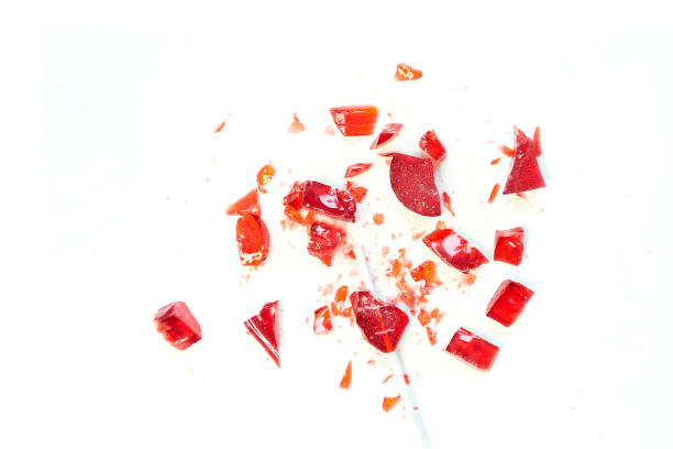 istock broken heart red lollipop sweet isolated on white background 1212024105