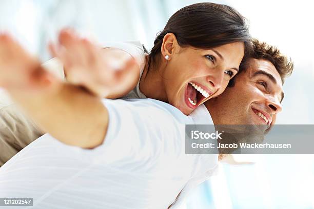 Playful Young Couple Having Fun Stock Photo - Download Image Now - 20-24 Years, 20-29 Years, 25-29 Years