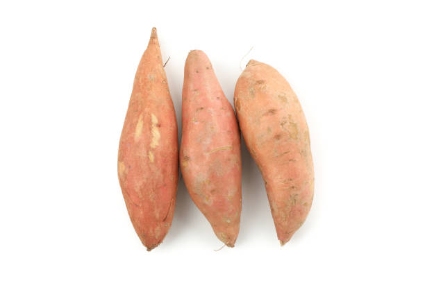 istock Sweet potato isolated on white background. Vegetables 1212025575