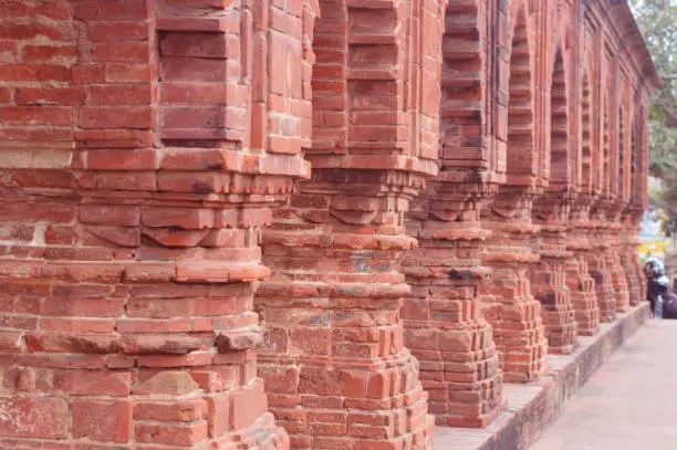 Photo of beautiful arches of old temple made up of red bricks known as Rasmancha