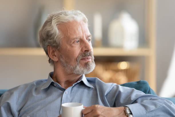 istock Thoughtful elderly man loo in distance thinking or mourning 1212026826