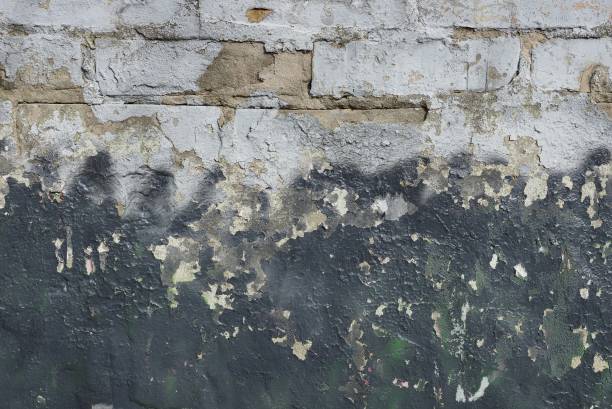 istock texture of black shabby stucco and gray bricks 1212026946