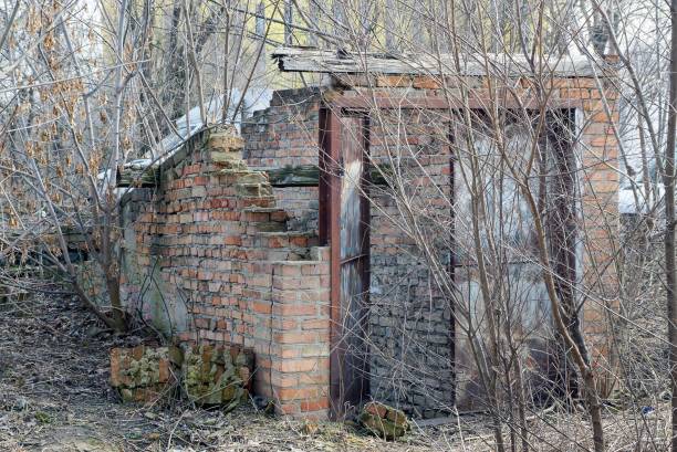 istock old ruined brown brick building with rusty iron door 1212026983