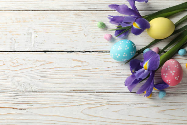 istock Composition with Easter eggs and Iris flowers on wooden background, space for text 1212028109