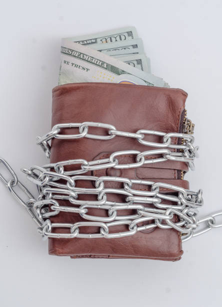 istock Money purse rewound with metal chain 1212028126