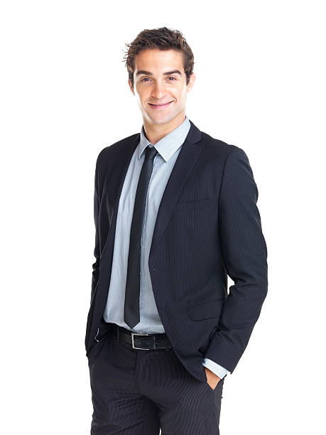 istock Young businessman standing with hands in pockets 121202936