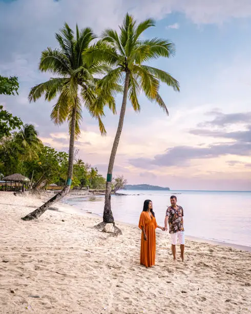 Photo of Saint Lucia Caribbean Island, couple on luxury vatation at the tropical Island of Saint Lucia, men and woman by the beach and crystal clear ocean of St Lucia Caribbean Holliday