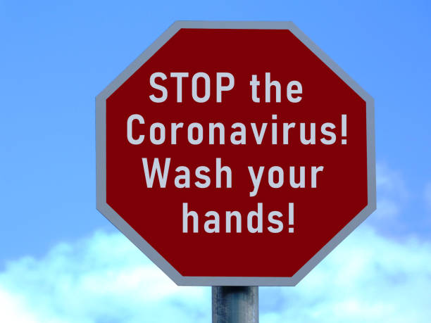 istock Stop the Coronavirus. Wash your hands. Red and white stop sign design. 1212034534