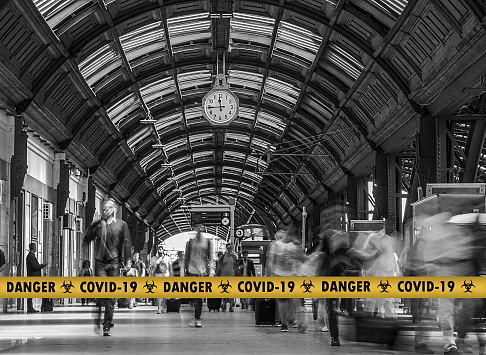 Warning tapes in Milan Central Station and crowds of panicked people leaving the city because of the coronavirus COVID-19 epidemic danger, in Milan, Lombardy, Italy.