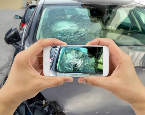 man photographing his car with damages at city - shattered glass broken window damaged imagens e fotografias de stock