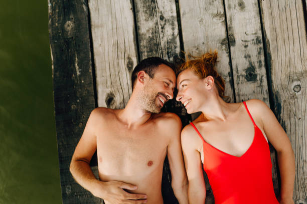 istock Loving couple on a lake 1212036874