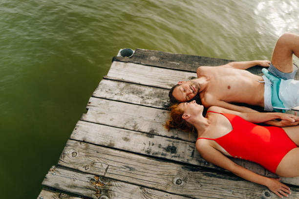 istock Loving couple on a lake 1212036876