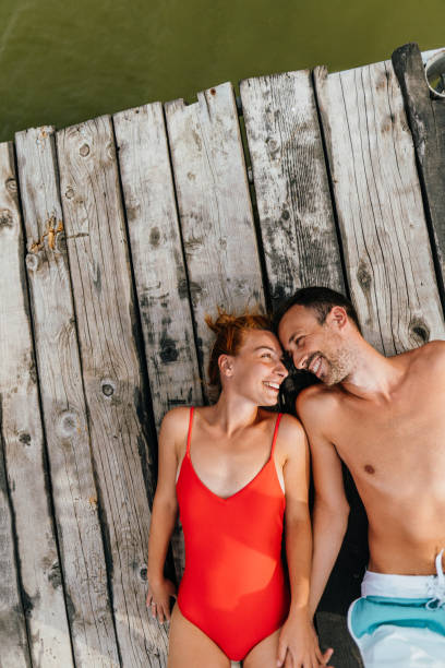 istock Loving couple on a lake 1212036974