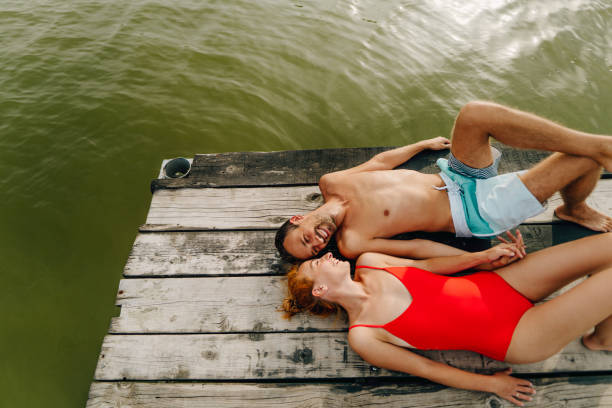 istock Loving couple on a lake 1212037037