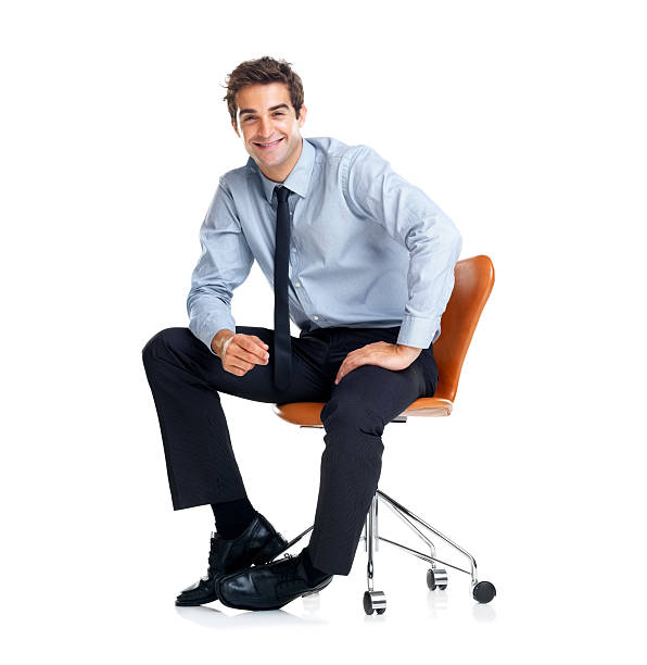 istock Handsome young businessman sitting on chair 121203995