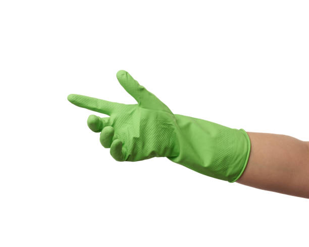 istock green rubber glove for cleaning is dressed on the hand 1212040796