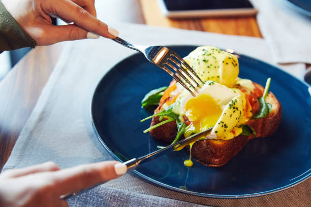 istock Benedict with pickled salmon and spinach on a blue plate 1212041178