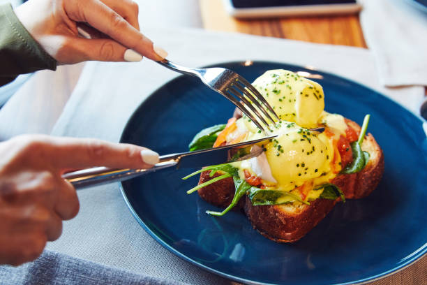 istock Benedict with pickled salmon and spinach on a blue plate 1212041232
