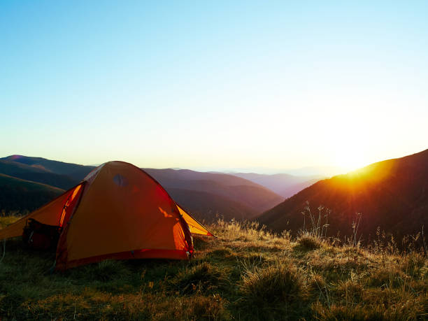 istock Orange tent in the mountains. 1212043229