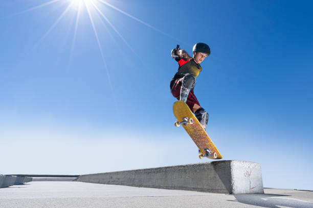 A young athletic boy skateboarding.