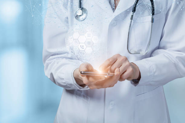 istock Doctor works on the phone in a global network. 1212047102