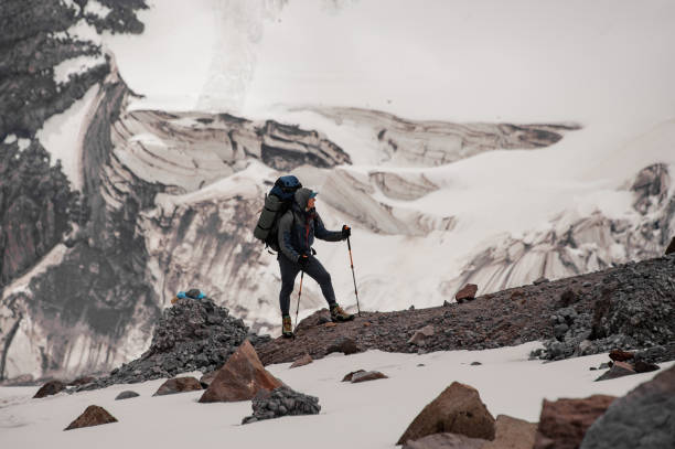 istock Journeyman with full climbing equipment stands on mountain 1212048287