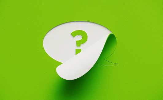 White chat bubble on green background. Question mark written on the chat bubble. Horizontal composition with copy space.