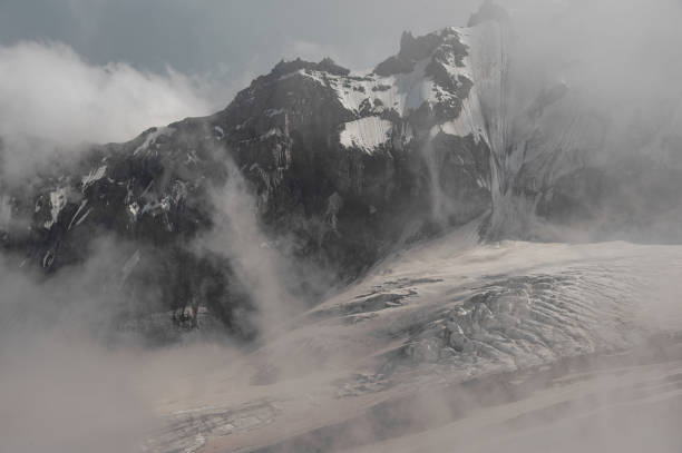 istock Great mountains covered in snow and fog 1212049964