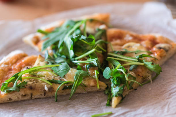 istock Home made pizza, pieces on table, close up 1212049995