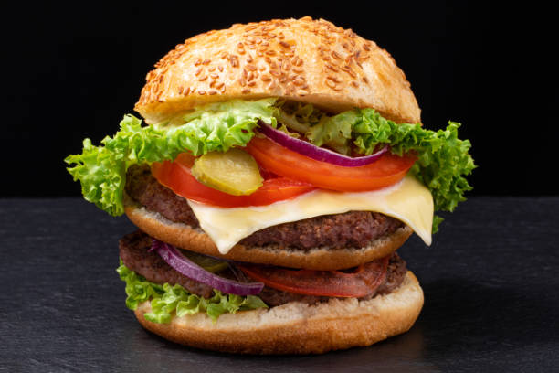 istock fresh tasty beef burger on dark background 1212052799