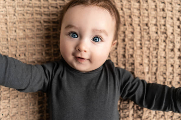 istock The cute baby boy lying on the knitted blanket 1212053984