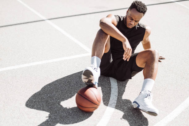 istock basketball player resting in the court 1212057315
