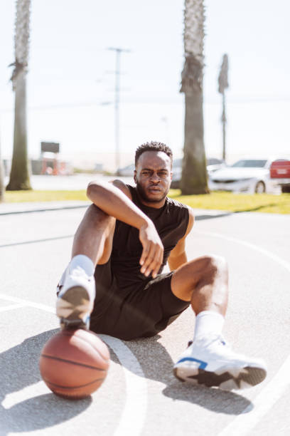 istock basketball player resting in the court 1212057600