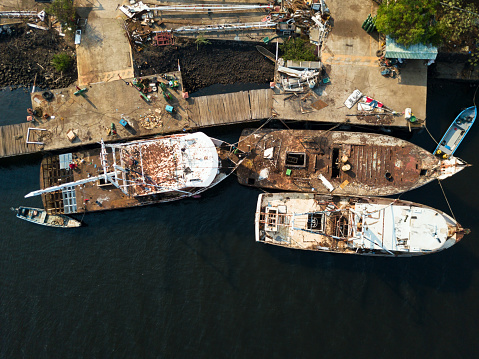 A group of shrimping boats docked for repairs in a local shipyard in Jiquilisco bay, El Salvador