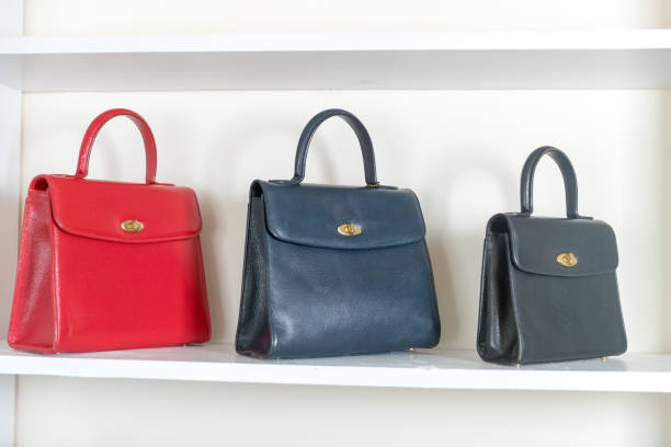 istock Vintage bag on the white shelf 1212058690