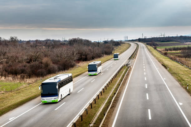 istock Three local line buses in line traveling on a highway 1212061352