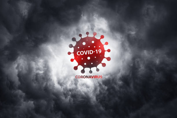 Warning about the scary COVID-19 virus. World pandemic with coronavirus COVID19. Wuhan city is a threat to humanity. Bacteria on a background of thunderclouds stock photo