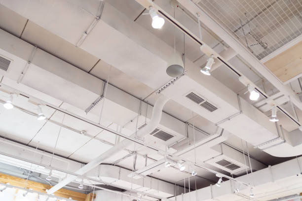 istock Ventilation ducts system painted in white composition of fire protection under the ceiling 1212062073