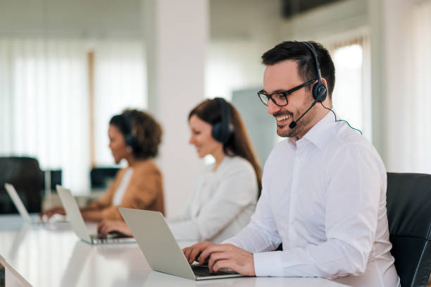 istock Smiling entrepreneur having video call at co-working office, portrait. 1212062360