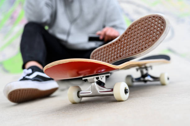 istock Young latin skater man posing with skateboard at skate park. 1212063178